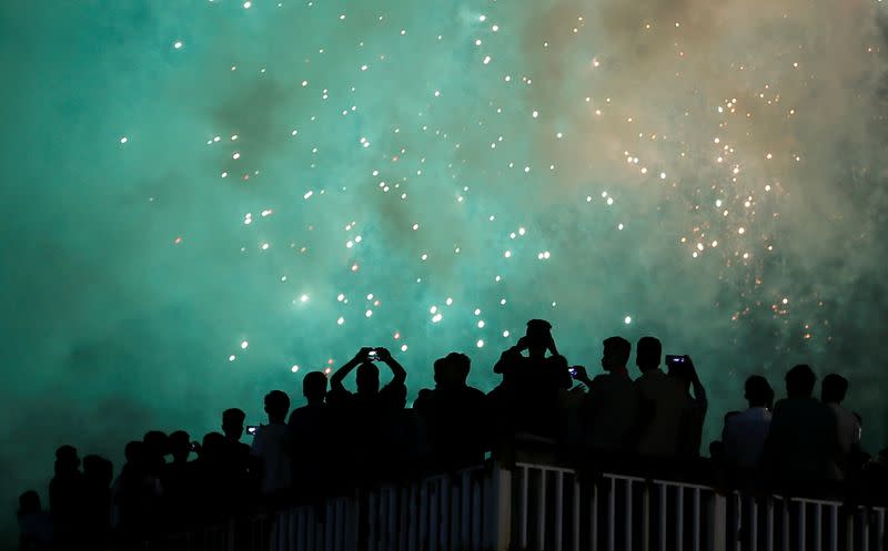 People watch the fireworks during the New Year's celebrations in Colombo