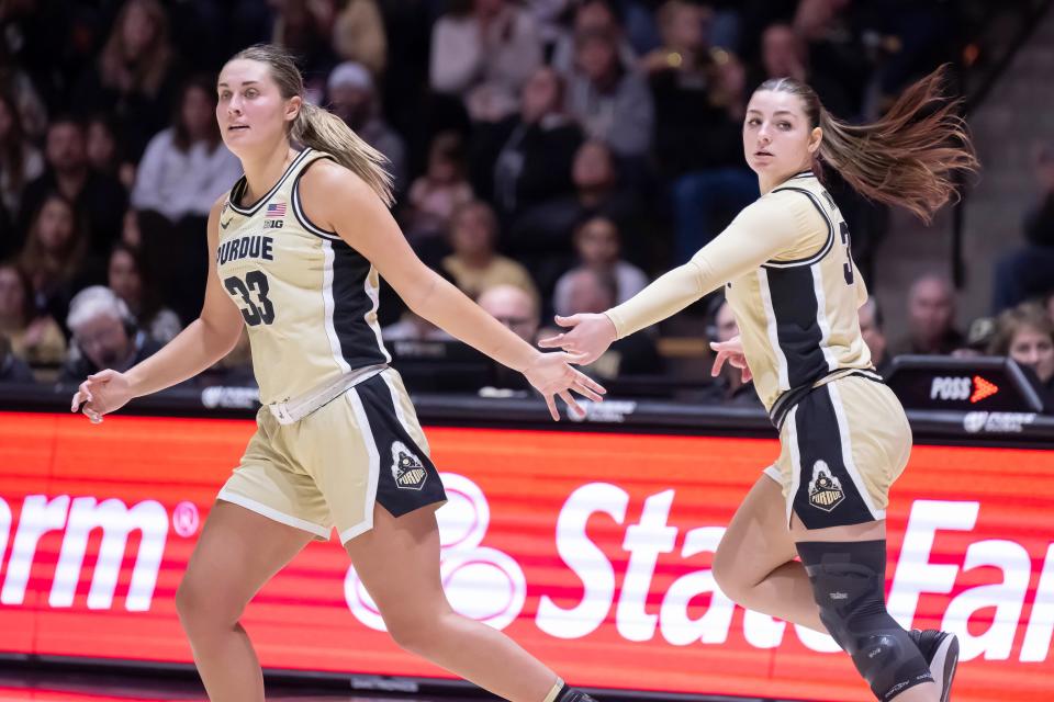 Purdue Boilermakers guard Madison Layden (33) thanks Purdue Boilermakers guard Sophie Swanson (31) during the NCAA women’s basketball game against the Wisconsin Badgers, Saturday Dec. 30, 2023, at Mackey Arena in West Lafayette, Ind. Purdue won 89-50.