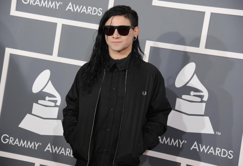 Skrillex arrives at the 55th annual Grammy Awards on Sunday, Feb. 10, 2013, in Los Angeles. (Photo by Jordan Strauss/Invision/AP)