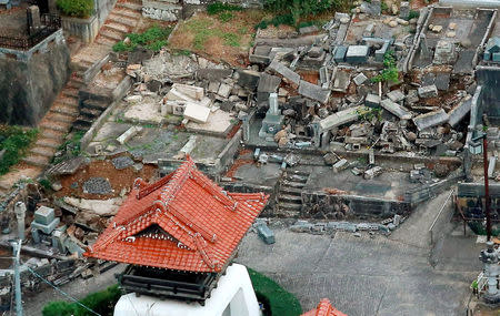 Gravestones damaged by an earthquake are seen in Kurayoshi, Tottori prefecture, Japan, October 21, 2016 in this photo released by Kyodo. Mandatory credit Kyodo/via REUTERS