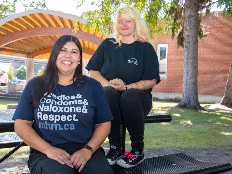 Solange Machado, left, is the Brandon co-ordinator with the Manitoba Harm Reduction Network. Destiny Cathcart, right, is co-chair of the organization's peer advisory council. They encourage people not to use street drugs alone, after benzodiazpeine was detected in a drug sample from Brandon. (Chelsea Kemp/CBC - image credit)