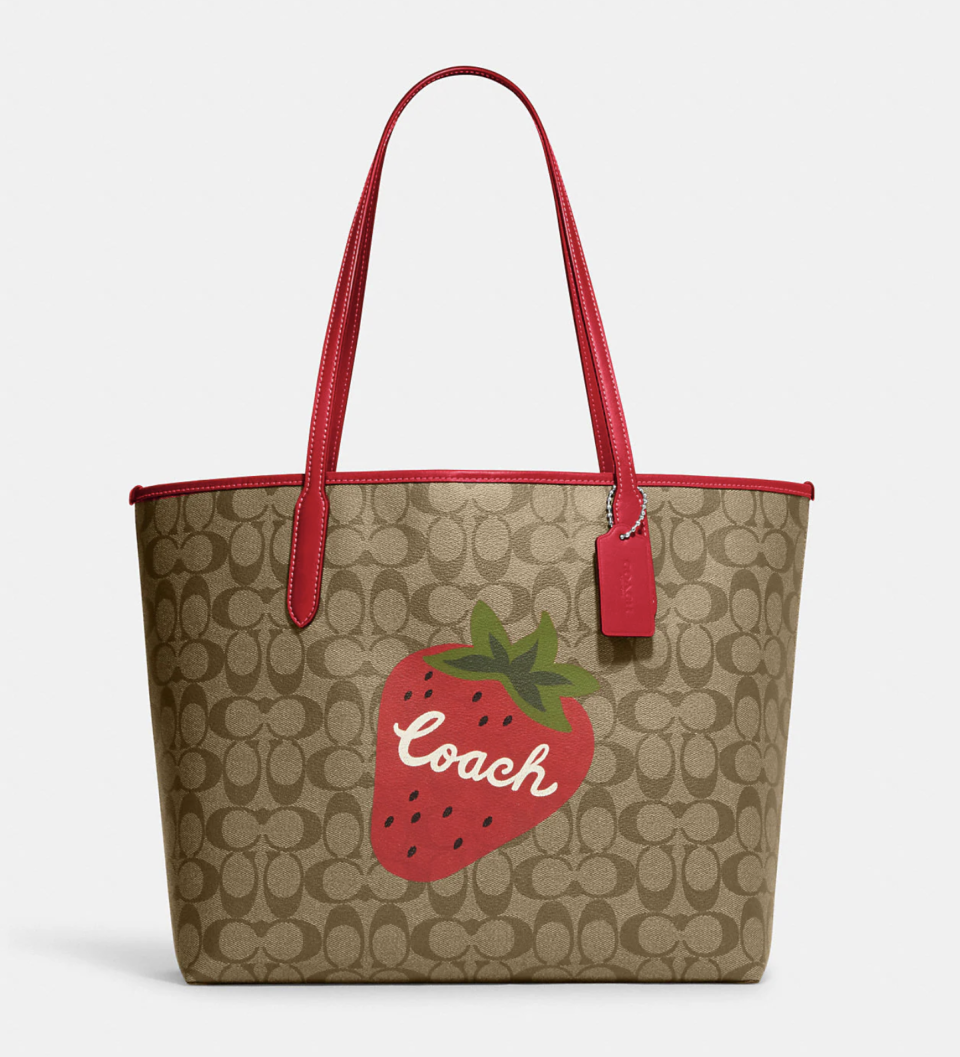 City Tote In Signature Canvas With Wild Strawberry. (Photo via Coach Outlet)