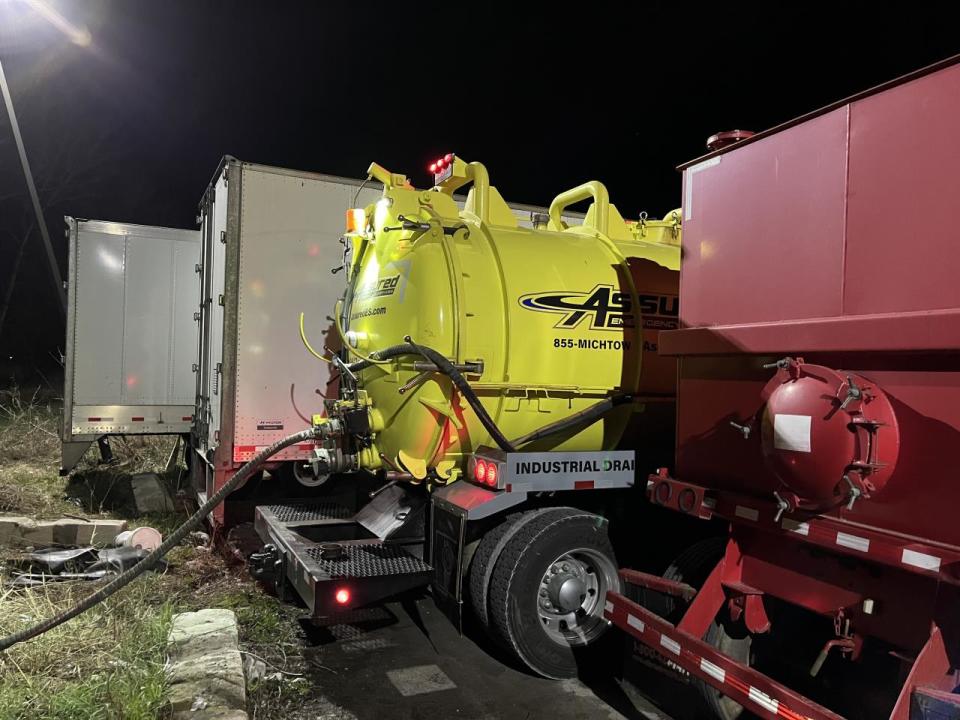 Vacuum trucks removed oil and oil-contaminated water from Tenmile Creek.