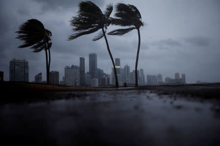 Dark clouds are seen over Miami's skyline before the arrival of Hurricane Irma to south Florida, U.S. September 9, 2017. REUTERS/Carlos Barria