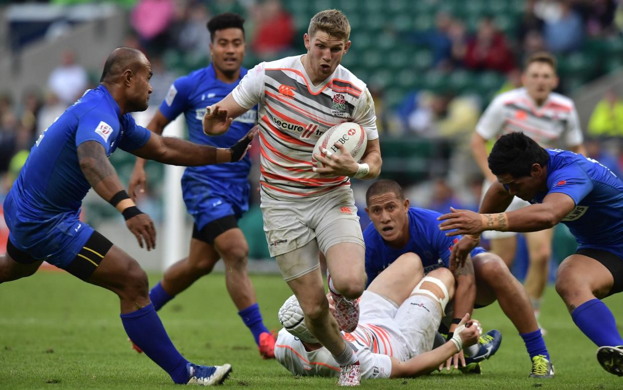 Ruaridh McConnochie of England runs at the Samoa back line during the HSBC London Sevens at Twickenham Stadium on May 20, 2017 in London, United Kingdom - Getty Images Europe