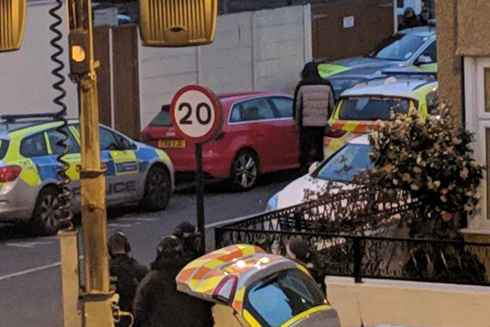 The person thought to have a gun was seen next to a car (Twitter)
