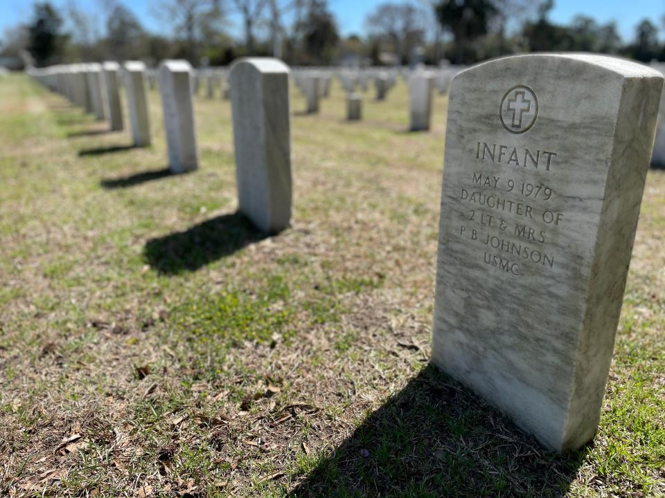 A headstone at New Bern National Cemetery marks the final resting place of the young daughter of a U.S. Marine Corps veteran.