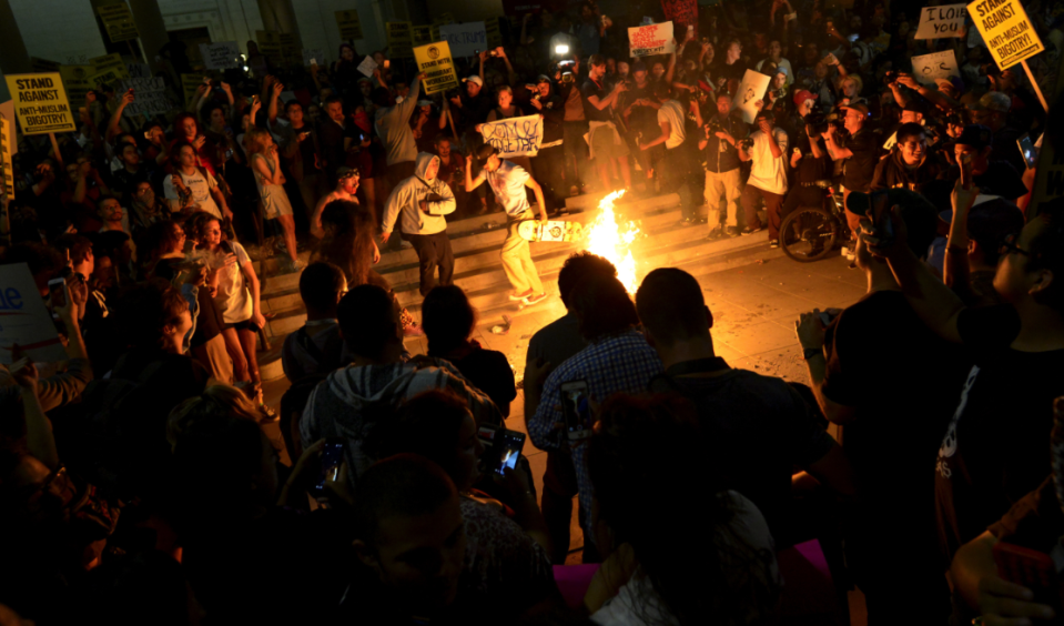 Protestors burn Trump effigy