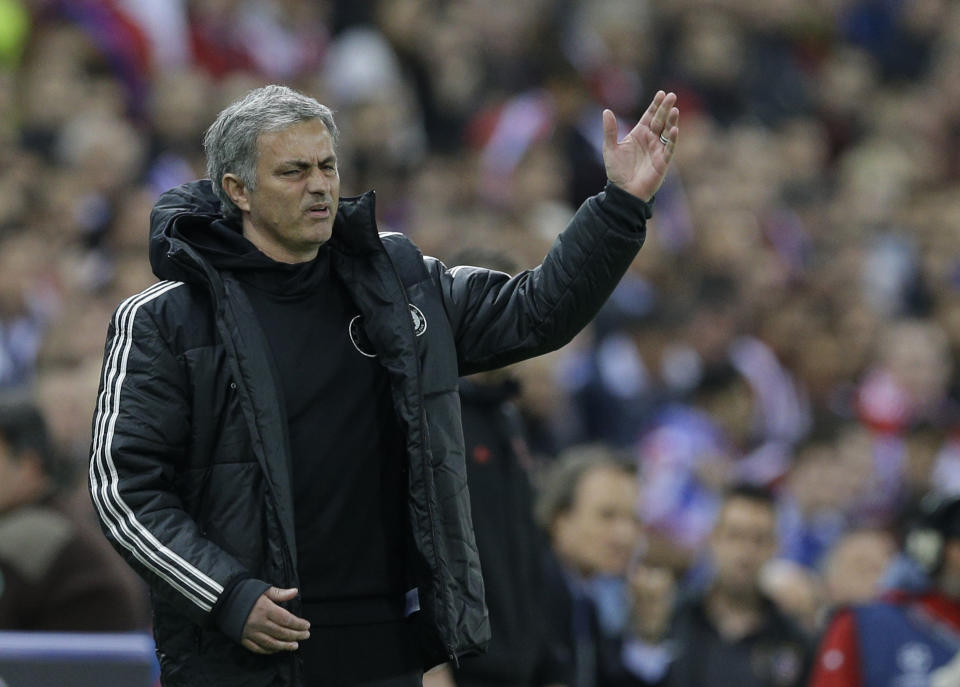 Chelsea's manager Jose Mourinho gestures as he watches his team from the technical area during the Champions League semifinal first leg soccer match between Atletico Madrid and Chelsea at the Vicente Calderon stadium in Madrid, Spain, Tuesday, April 22, 2014 .(AP Photo/Paul White)