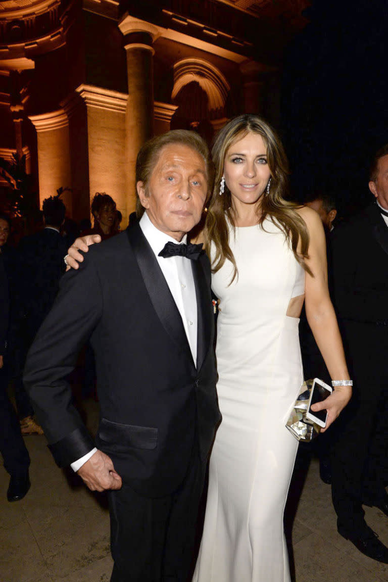 <p>Valentino Garavani and Elizabeth Hurley in Valentino</p>