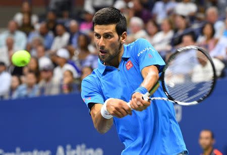 Aug 29, 2016; New York, NY, USA; Novak Djokovic of Serbia hits to Jerzy Janowicz of Poland on day one of the 2016 U.S. Open tennis tournament at USTA Billie Jean King National Tennis Center. Robert Deutsch-USA TODAY Sports