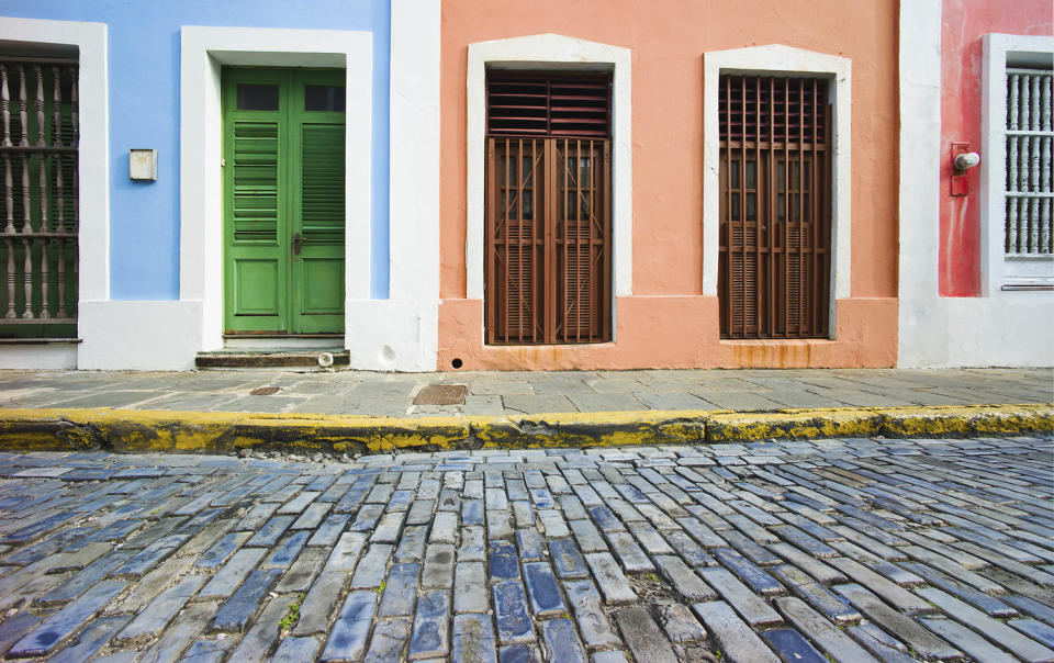 Puerto Rico, Old San Juan, door in houses on brick street (Getty Images)