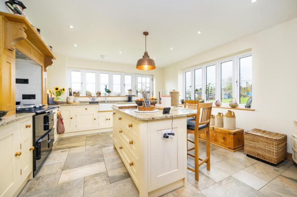 East Anglian Daily Times: The kitchen has a range of fitted appliances and matching base and wall shaker-style units