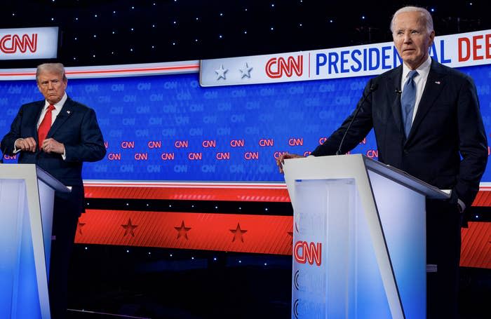 Donald Trump and Joe Biden stand at podiums during a CNN presidential debate