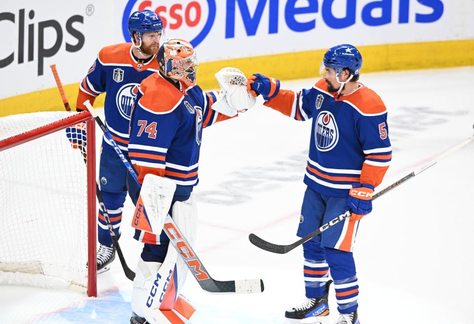 June 21, 2024; Edmonton, Alberta, CAN; Edmonton Oilers goaltender Stuart Skinner (74) and Edmonton Oilers defenseman Cody Ceci (5) celebrate after defeating the Florida Panthers in game six of the 2024 Stanley Cup Final at Rogers Place. Mandatory Credit: Walter Tychnowicz-USA TODAY Sports