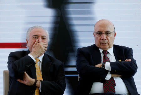 Brazil's President Michel Temer (L) reacts next to presidential candidate for the Brazilian Democratic Movement party (MDB), former Finance Minister Henrique Meirelles in Brasilia, Brazil May 22, 2018. REUTERS/Adriano Machado