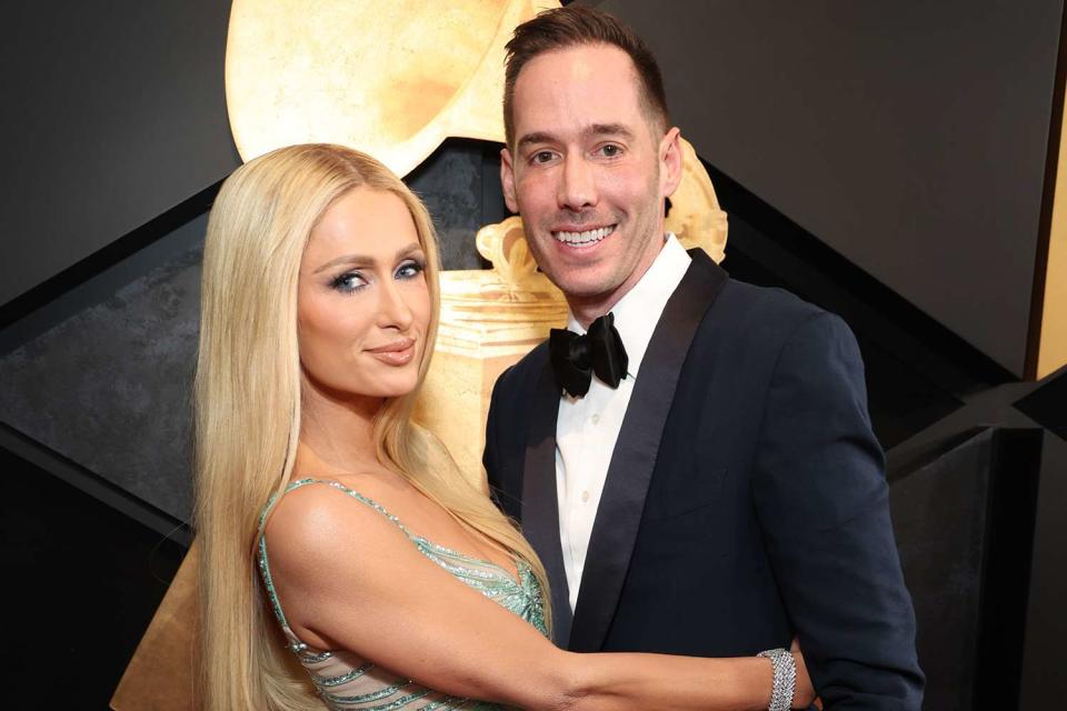 <p>Kevin Mazur/Getty</p> Paris Hilton and Carter Reum at the 2024 Grammys