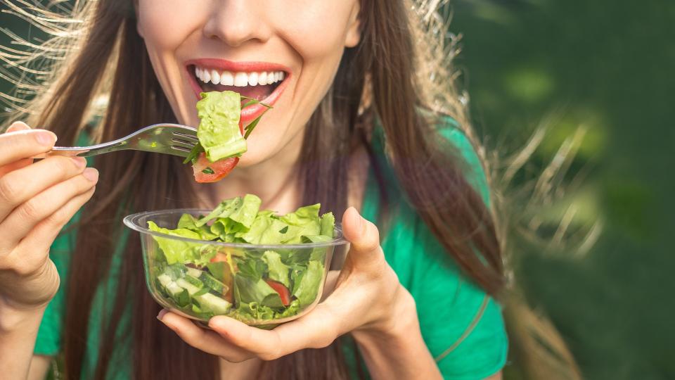 woman eating a salad