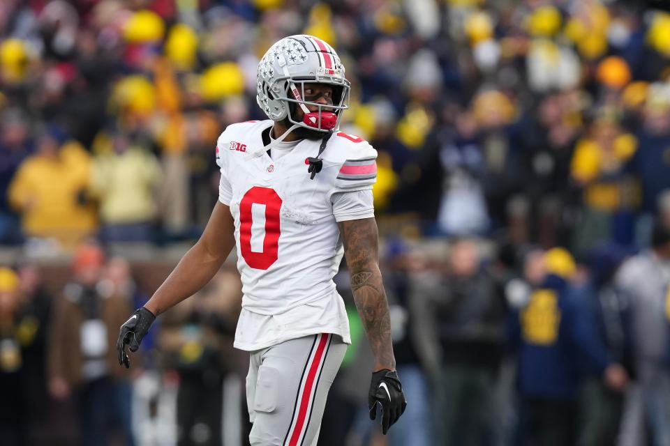 Nov 25, 2023; Ann Arbor, Michigan, USA; Ohio State Buckeyes wide receiver Xavier Johnson (0) walks off the field in the final seconds of the NCAA football game against the Michigan Wolverines at Michigan Stadium. Ohio State lost 30-24.