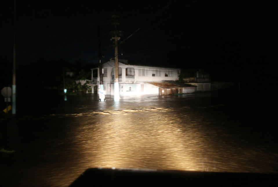 <p>A rescue team from the local emergency management agency inspects flooded areas after the passing of Hurricane Irma on Sept. 6, 2017 in Fajardo, Puerto Rico. (Photo: Jose Jimenez/Getty Images) </p>