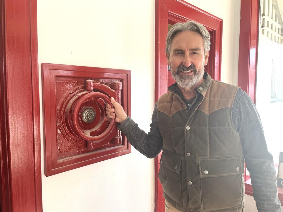 Businessman Mike Wolfe of Franklin tours the construction progress on his new food and drink concept venue on the corner of 6th Street and North Main Street in downtown Columbia, Tenn. The new eatery, once a gas station decades ago, will be located where Vintage Winery once operated.