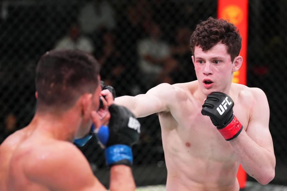 LAS VEGAS, NEVADA – MAY 21: (R-L) Chase Hooper battles Felipe Colares of Brazil in a featherweight bout during the UFC Fight Night event at UFC APEX on May 21, 2022 in Las Vegas, Nevada. (Photo by Chris Unger/Zuffa LLC)