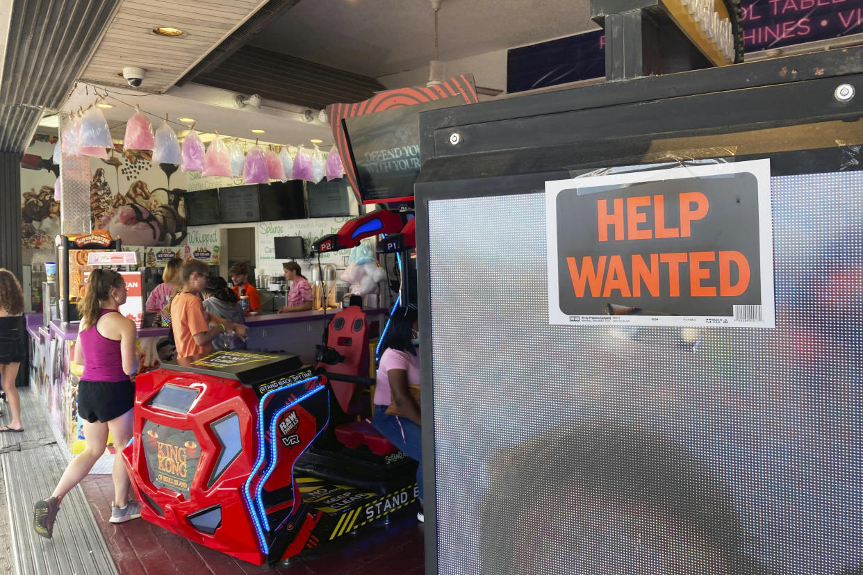 A Help Wanted sign hangs at an arcade on the boardwalk in Ocean City, New Jersey, on Thursday, July 22, 2021. (AP Photo/Ted Shaffrey).