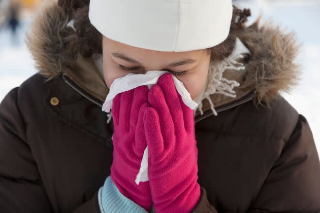 Touching your face with gloves could be particularly unsanitary, considering where they may have been. (Photo: Jose Luis Pelaez Inc via Getty Images)