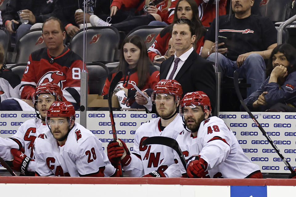 Carolina Hurricanes head coach Rod Brind'Amour looks on against the New Jersey Devils during the third period of Game 4 of an NHL hockey Stanley Cup second-round playoff series Tuesday, May 9, 2023, in Newark, N.J. The Hurricanes won 6-1. (AP Photo/Adam Hunger)