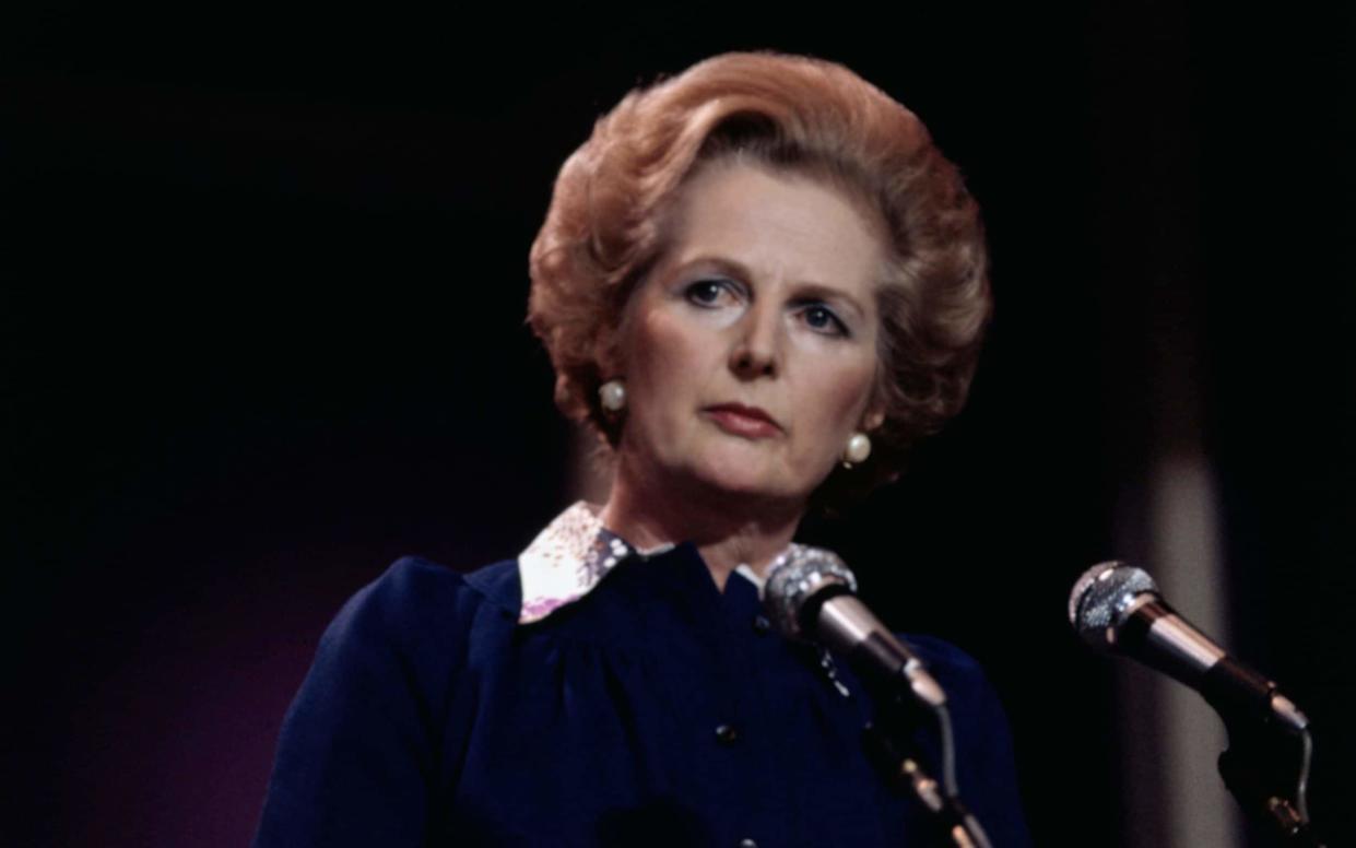 Margaret Thatcher, leader of the British Conservative Party, is on the threshold of becoming Britain's first woman Prime Minister. Mrs. Thatcher wears dark blue dress with white collar, background is dark. - Bettmann Archive