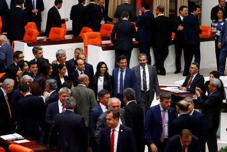 Pro-Kurdish opposition Peoples' Democratic Party (HDP) MPs pose for a group picture during the voting of an article of constitutional change that could see pro-Kurdish and other lawmakers prosecuted, at the Turkish parliament in Ankara, Turkey, May 20, 2016. REUTERS/Umit Bektas