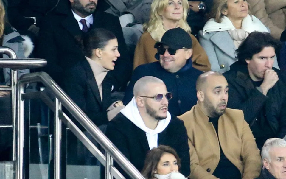 Leonardo DiCaprio and Camilla Morrone at a game