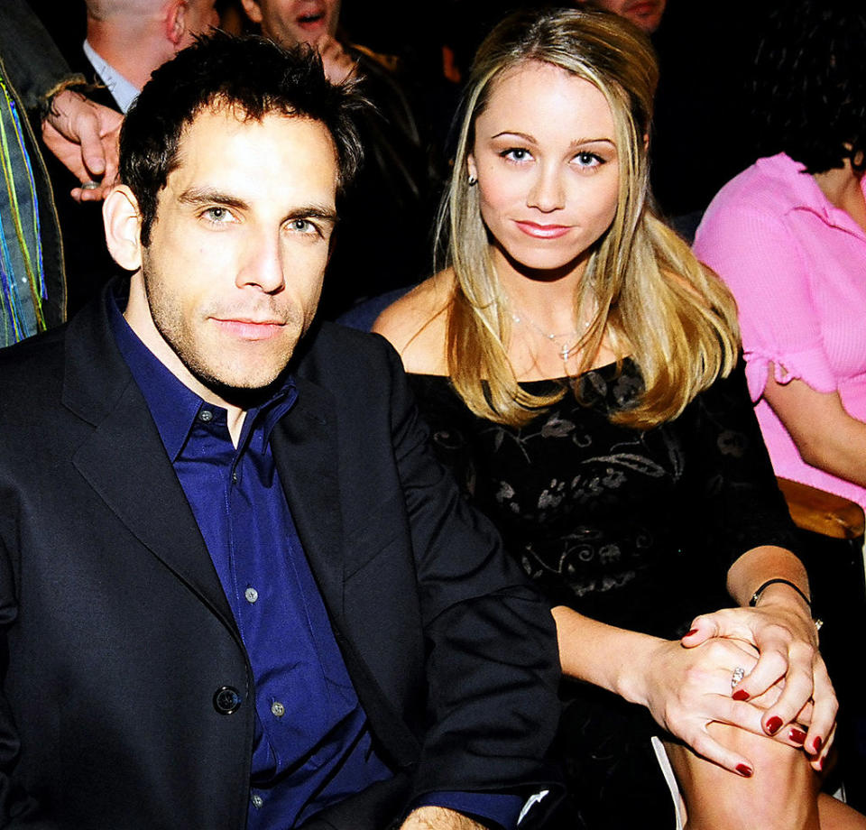 the couple seated closely with Ben in a dark suit and shirt, Christine in a patterned dress