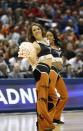 Texas cheerleaders perform during the first half of a second-round game between the Texas and the Arizona State in the NCAA college basketball tournament Thursday, March 20, 2014, in Milwaukee. (AP Photo/Jeffrey Phelps)
