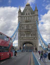 Tower Bridge crossing the River Thames is stuck open, leaving traffic in chaos as the iconic river crossing remains open, in London, Saturday Aug. 22, 2020. The historic bridge has failed to close Saturday after opening to allow ships to pass underneath on the River Thames. (AP Photo / Tony Hicks)