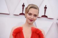 <p>A tonal red lip was the perfect finishing touch for Seyfried's Giorgio Armani Privé gown, while her waved hair was a nod to classic awards glamour. </p>