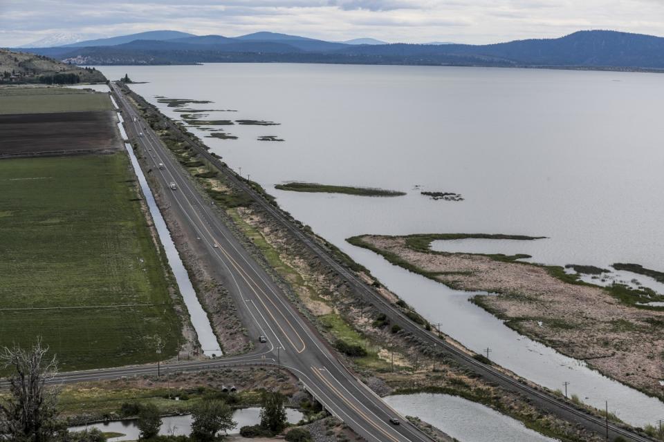 Highway 97 separates farmland from the Upper Klamath Lake in Oregon.