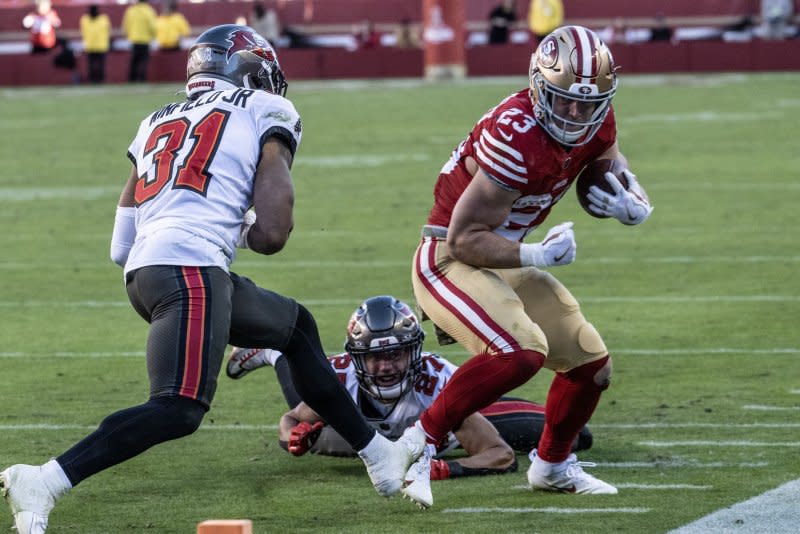 San Francisco 49ers running back Christian McCaffrey (R) is forced out of bounds by Tampa Bay Buccaneers safety Antoine Winfield Jr. on Sunday at Levi's Stadium in Santa Clara. Calif. Photo by Terry Schmitt/UPI