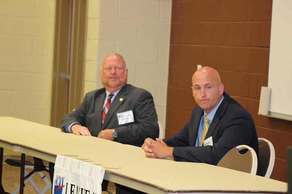 Sheriff Russell Barker, left, and Independent candidate Rusty Carr await questions during the League of Women Voters of Oak Ridge sponsored forum last Thursday. The League forum for candidates in the Anderson County General Election was held at the Oak Ridge campus of Roane State Community College.