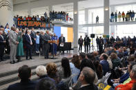 New York City Mayor Eric Adams, center left, speaks at an event in the Queens Museum in New York, Wednesday, Nov. 16, 2022. Adams was announcing the construction of a new soccer stadium, along with thousands of units of affordable housing, in the dilapidated section of Queens known as Willets Point. (AP Photo/Seth Wenig)