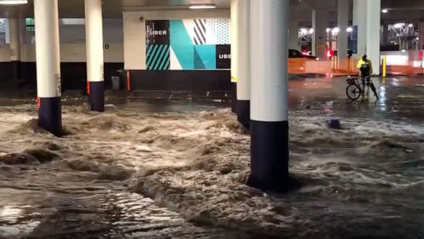 PHOTO: Water rushes through a parking garage during flash flooding on the Las Vegas strip, July 28, 2022. (CoachKenCamp/Twitter)