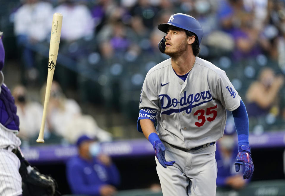 FILE - In this April 2, 2021, file photo, Los Angeles Dodgers' Cody Bellinger tosses his bat after flying out against Colorado Rockies starting pitcher Antonio Senzatela during the second inning of a baseball game in Denver. Bellinger is ready to return from a broken leg that's sidelined him for nearly two months. Dodgers manager Dave Roberts said Friday, May 28, the 2019 NL MVP will start in center field on Saturday and Sunday against San Francisco. (AP Photo/David Zalubowski, File)