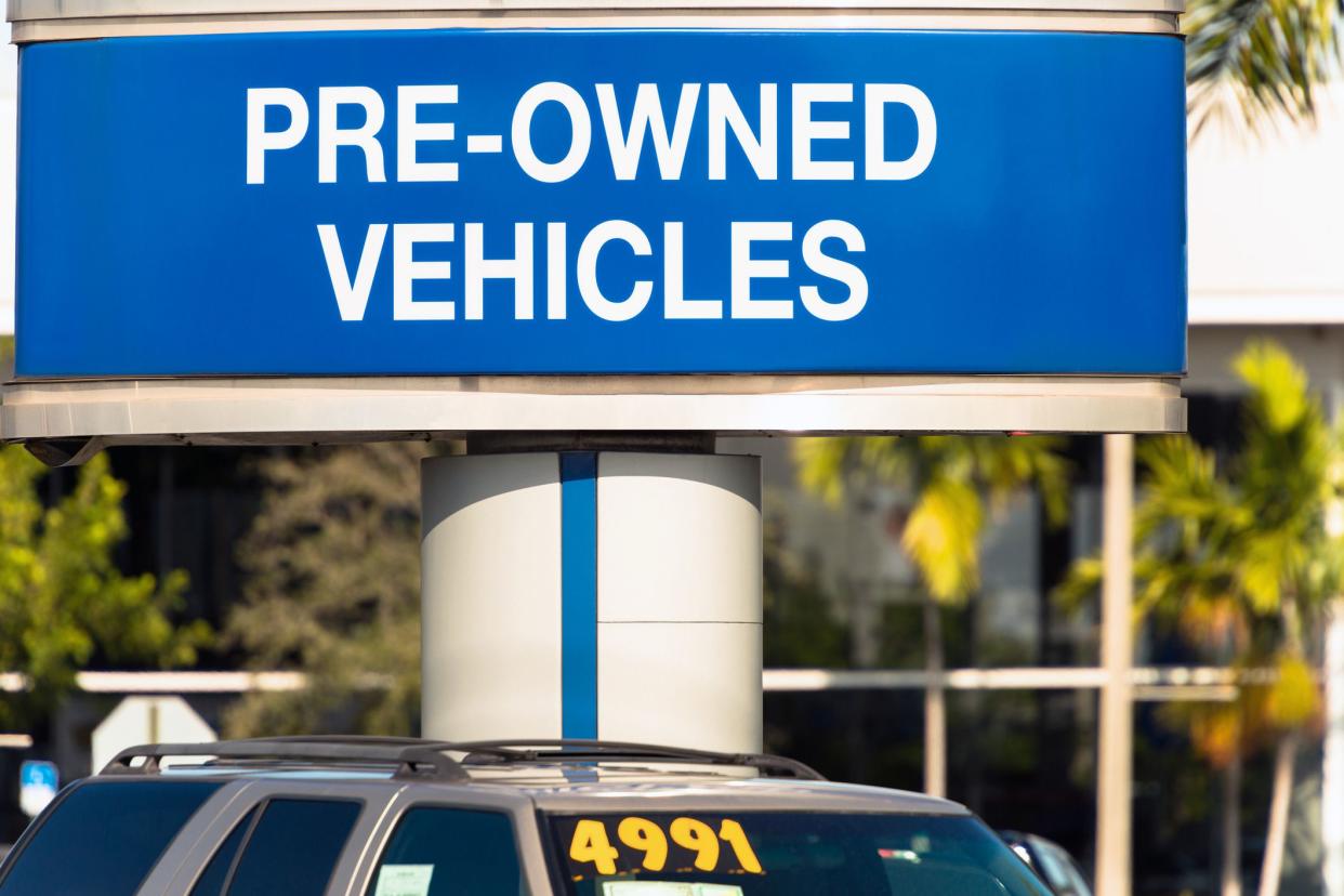 pre-owned vehicles section of parking lot at car dealership