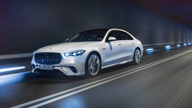 a white 2023 mercedes-amg s 63 e performance sedan driving through a dark tunnel