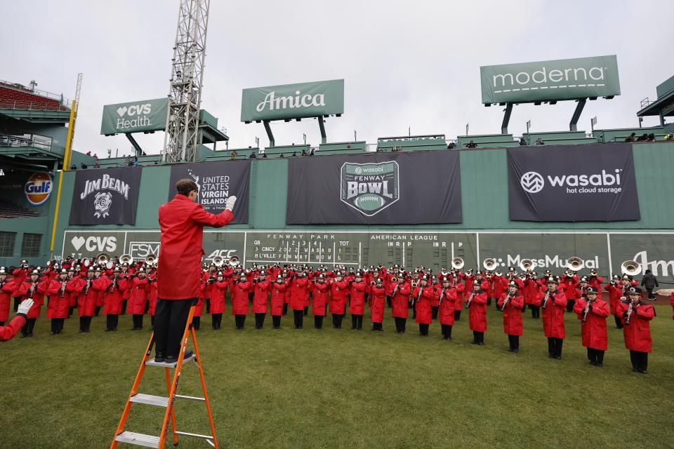 The Cincinnati marching band performs before the Fenway Bowl NCAA college football game against Louisville at Fenway Park Saturday, Dec. 17, 2022, in Boston. (AP Photo/Winslow Townson)