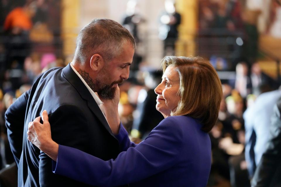 December 6, 2022: Speaker of the House Nancy Pelosi of Calif., embraces former Washington Metropolitan Police Department officer Michael Fanone before the start of a Congressional Gold Medal ceremony honoring law enforcement officers who defended the U.S. Capitol on Jan. 6, 2021, in the U.S. Capitol Rotunda in Washington.