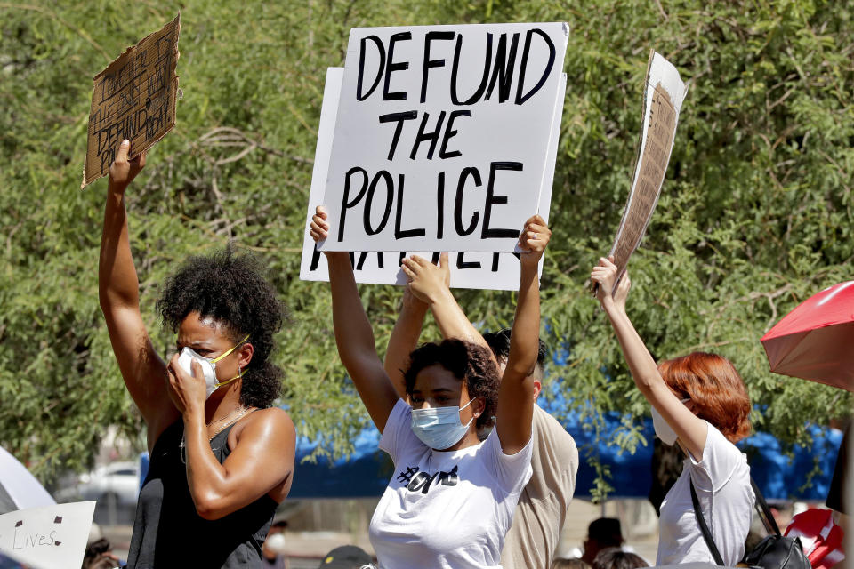 Protesters rally on June 3 in Phoenix demanding the city council defund the police department. The protest, like others nationwide, was sparked by the death of George Floyd, a Black man who was killed by Minneapolis police on May 25. (Photo: ASSOCIATED PRESS)
