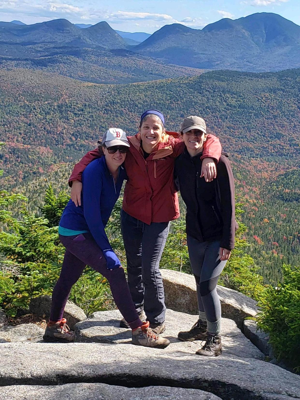 Erin Drew, Trish Castro and Micaela Quill on a hike in 2021. They are hiking four peaks in the White Mountains May 13 in support of their friend Rosie, who is battling a rare form of cancer.