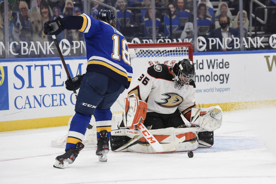 Anaheim Ducks' John Gibson (36) blocks a shot from St. Louis Blues' Robert Thomas (18) during the second period of an NHL hockey game Friday, March 26, 2021, in St. Louis. (AP Photo/Joe Puetz)