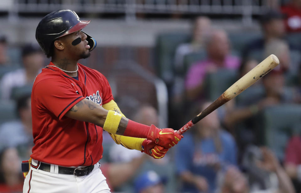 Atlanta Braves' Ronald Acuña Jr. watches his three-run home run off Washington Nationals' Erick Fedde during the second inning of a baseball game Friday, July 8, 2022, in Atlanta. (AP Photo/Ben Margot)